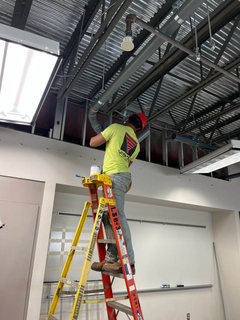 employee installing aces waste system